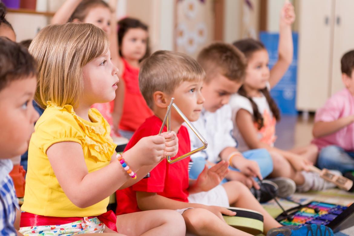 Kindergarten children playing classroom instruments